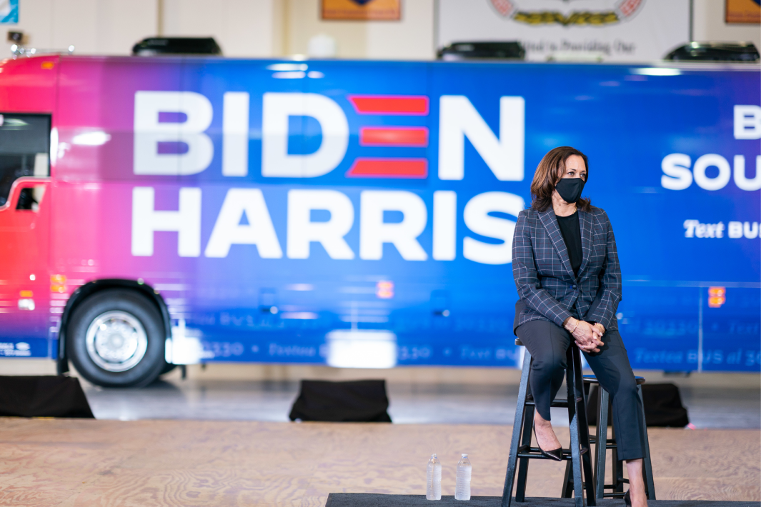 VP Kamala Harris sitting in front of Biden/Harris bus